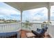 Overlooking the water, this covered balcony provides a great place to relax at 442 Midway Is, Clearwater Beach, FL 33767