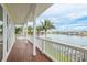 Balcony shows a beautiful waterfront with palm trees and other homes at 442 Midway Is, Clearwater Beach, FL 33767