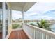 Scenic balcony view showcasing waterfront vistas with palm trees and city skyline on a sunny day at 442 Midway Is, Clearwater Beach, FL 33767