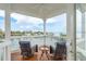 Relax on this covered porch with wonderful water views at 442 Midway Is, Clearwater Beach, FL 33767
