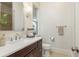 Bathroom featuring a vanity with dark wood cabinets and a white countertop at 442 Midway Is, Clearwater Beach, FL 33767