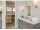 Bright bathroom with a vanity, quartz countertop and walk-in closet at 442 Midway Is, Clearwater Beach, FL 33767