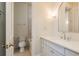 Bathroom featuring a sink with cabinets, and a water closet with an open door at 442 Midway Is, Clearwater Beach, FL 33767