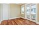 Bedroom with hardwood floors and closet, a window and glass paneled doors at 442 Midway Is, Clearwater Beach, FL 33767