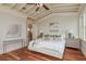 Bright bedroom featuring hardwood floors, natural light, and neutral decor at 442 Midway Is, Clearwater Beach, FL 33767