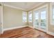 Bedroom with hardwood floors, french doors, windows, and views of water at 442 Midway Is, Clearwater Beach, FL 33767