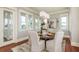 Formal dining room with seating for six and large windows at 442 Midway Is, Clearwater Beach, FL 33767