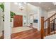 Inviting entryway with wood floors, double doors, and a view to the second story chandelier at 442 Midway Is, Clearwater Beach, FL 33767