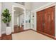 Impressive foyer featuring soaring ceilings, wood floors, and stylish archways at 442 Midway Is, Clearwater Beach, FL 33767