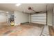 A large, open garage with an automatic door and ample space for vehicles and storage at 442 Midway Is, Clearwater Beach, FL 33767