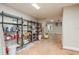 A large garage with industrial shelving, storage for paints and tools, and room for a workbench at 442 Midway Is, Clearwater Beach, FL 33767