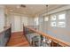 Hallway featuring wood floors, white doors, and trim with lots of natural light at 442 Midway Is, Clearwater Beach, FL 33767