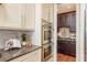 Kitchen boasts stainless steel appliances, granite countertops, and ample storage space at 442 Midway Is, Clearwater Beach, FL 33767