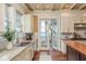 Bright kitchen features granite countertops, stainless steel appliances and a water view at 442 Midway Is, Clearwater Beach, FL 33767