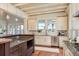 Charming kitchen features granite countertops, stainless steel appliances and island seating at 442 Midway Is, Clearwater Beach, FL 33767
