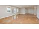 Spacious living room boasts glossy tile floors, neutral walls, and views of the outside scenery at 442 Midway Is, Clearwater Beach, FL 33767