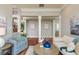 Bright living room featuring hardwood floors, white columns, and stylish modern furnishings at 442 Midway Is, Clearwater Beach, FL 33767