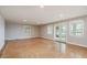 Bright living room with glossy tile floors and glass doors offers scenic water views at 442 Midway Is, Clearwater Beach, FL 33767