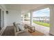 Outdoor patio with brick flooring, waterfront views, and seating area at 442 Midway Is, Clearwater Beach, FL 33767