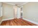 Neutral colored room featuring hardwood floors, white trim, and two entryways at 442 Midway Is, Clearwater Beach, FL 33767