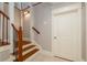 Traditional staircase with wooden banister and iron spindles leads to the upper level of the home at 442 Midway Is, Clearwater Beach, FL 33767