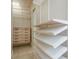 Organized walk-in closet featuring adjustable shelves and drawers at 442 Midway Is, Clearwater Beach, FL 33767