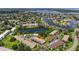 Community aerial view featuring the community buildings, swimming pool, and lush landscape from above at 4540 Overlook Ne Dr # 246, St Petersburg, FL 33703