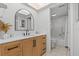 Bathroom vanity with modern mirror and combined shower and bathtub at 4540 Overlook Ne Dr # 246, St Petersburg, FL 33703