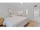 Bedroom with wood floors, neutral decor, and lots of light at 4540 Overlook Ne Dr # 246, St Petersburg, FL 33703