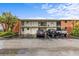 Well-maintained condo building with ample parking, manicured landscaping, and a classic brick and white facade at 4540 Overlook Ne Dr # 246, St Petersburg, FL 33703