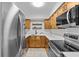 Updated kitchen featuring stainless steel appliances and light wood cabinets at 4540 Overlook Ne Dr # 246, St Petersburg, FL 33703