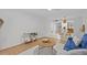 Open living space featuring wood flooring, neutral tones, a comfortable blue sofa, and modern decor at 4540 Overlook Ne Dr # 246, St Petersburg, FL 33703