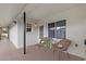 Cozy condo patio with neutral tones, two wicker chairs, and a charming plant on a small, wooden table at 4540 Overlook Ne Dr # 246, St Petersburg, FL 33703