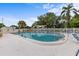 Outdoor swimming pool with lounge chairs, surrounded by a well-maintained fence for privacy at 4540 Overlook Ne Dr # 246, St Petersburg, FL 33703