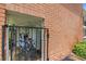 Secured bike storage behind a gated entrance within the building's brick exterior at 4540 Overlook Ne Dr # 246, St Petersburg, FL 33703