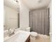 Bathroom featuring a modern sink and a shower/tub combination with a neutral shower curtain at 4668 66Th N Pl, Pinellas Park, FL 33781