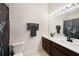 Bathroom featuring double sinks, spacious countertop, and stylish dark fixtures at 4668 66Th N Pl, Pinellas Park, FL 33781