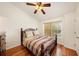Comfortable bedroom with natural light and wood laminate flooring, creating a welcoming atmosphere at 4668 66Th N Pl, Pinellas Park, FL 33781
