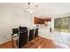 Open dining room with partial view of kitchen with stainless steel appliances and wood cabinets at 4668 66Th N Pl, Pinellas Park, FL 33781