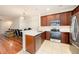Modern kitchen featuring stainless appliances, wood cabinets, and white countertops at 4668 66Th N Pl, Pinellas Park, FL 33781