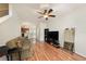 Inviting living room features gleaming wood floors and flows into the kitchen at 4668 66Th N Pl, Pinellas Park, FL 33781