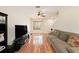 Spacious living room with hardwood floors, neutral tones, and a cozy sofa at 4668 66Th N Pl, Pinellas Park, FL 33781