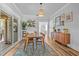 Inviting dining room with wooden table, stylish decor, and sliding door access to the outdoor living space at 5101 N Suwanee Ave, Tampa, FL 33603