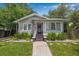 Charming single-story home featuring a well-manicured lawn and inviting front porch at 5101 N Suwanee Ave, Tampa, FL 33603