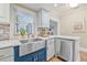 The kitchen features a large stainless steel sink and updated countertops at 5101 N Suwanee Ave, Tampa, FL 33603