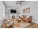 Comfortable living room showcasing a fireplace, hardwood floors, and stylish decor at 5101 N Suwanee Ave, Tampa, FL 33603