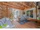 Relaxing outdoor patio with covered dining area, wooden seating, and rustic decor elements at 5101 N Suwanee Ave, Tampa, FL 33603