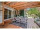 Inviting outdoor patio with covered dining area, stylish seating, and charming string lights at 5101 N Suwanee Ave, Tampa, FL 33603