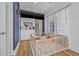 Well-lit playroom with playpen, storage and a comfortable seating area at 5101 N Suwanee Ave, Tampa, FL 33603