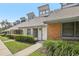 Charming townhome featuring unique architectural details and manicured landscaping at 5203 Oak Charter Ct # 5203, Temple Terrace, FL 33617